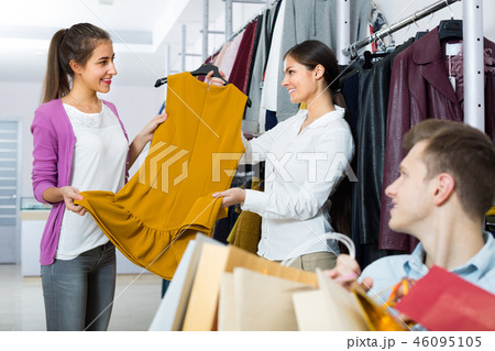 Young man waiting for female at shop Young man waiting for female at shop 46095105