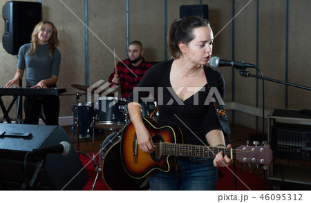 Glad guitar player and singer with band Glad guitar player and singer with band 46095312