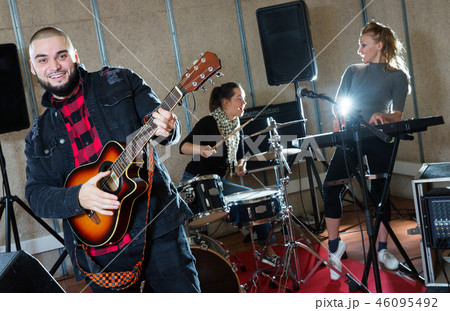 Emotional guy with guitar rehearsing 46095492