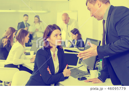 Ordinary boss scolding female subordinate Ordinary boss scolding female subordinate 46095779