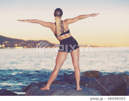 Female is practicing stretching 46096005
