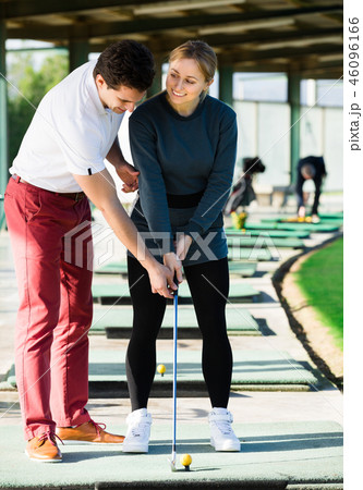 Female and male golfers are enjoying game 46096166