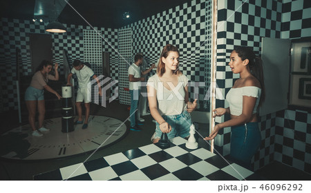 Five adults solving different conundrum in quest room Five adults solving different conundrum in quest room 46096292
