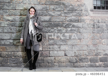 teenager girl in hood near wall 46096451