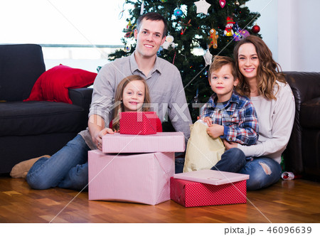 Family exchanging Christmas gifts 46096639