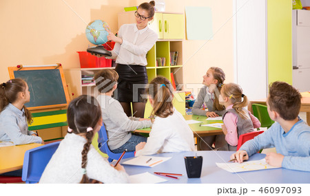 Positive boys and girls listening teacher Positive boys and girls listening teacher 46097093