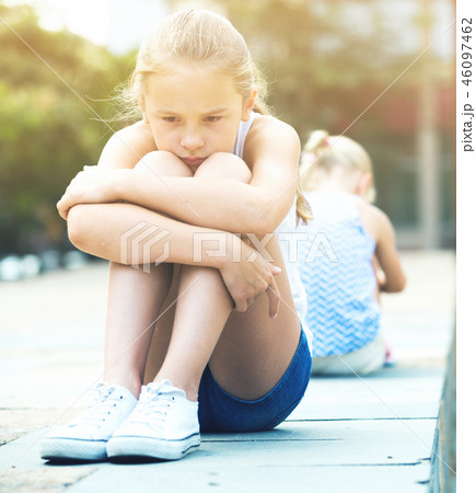Two offended girls after quarrel outdoors Two offended girls after quarrel outdoors 46097462