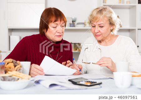 Serious old women with public utilities Serious old women with public utilities 46097561