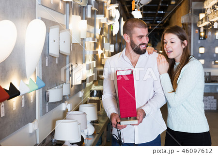 family looking night-light in the furniture store 46097612