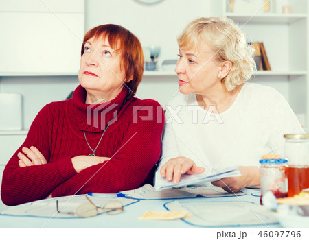 Serious old women with public utilities 46097796