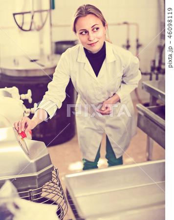 Portrait of young woman working in modern food factory Portrait of young woman working in modern food factory 46098119