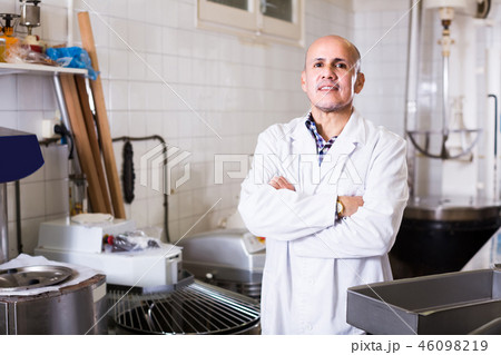 Portrait of mature man working in modern food factory Portrait of mature man working in modern food factory 46098219