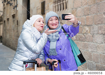 Senior ladies making selfie outdoors Senior ladies making selfie outdoors 46099058