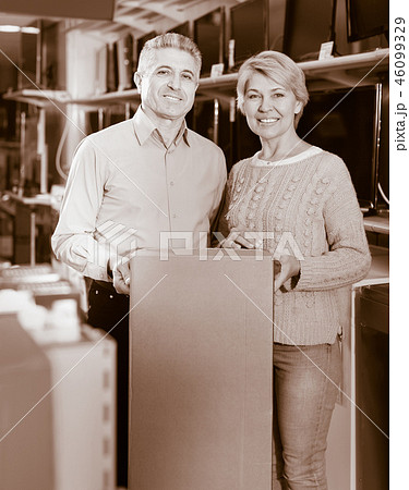 Mature couple are happy with choice and purchased consumer electronics 46099329