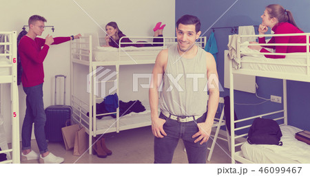 Smiling guy in hostel dormitory Smiling guy in hostel dormitory 46099467