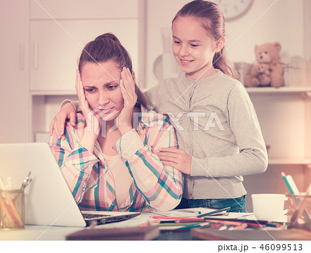 Irritated mother watching at the mistakes Irritated mother watching at the mistakes 46099513