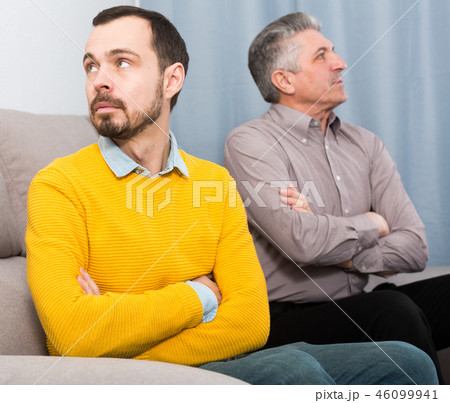 Adult father and son solve problems 46099941