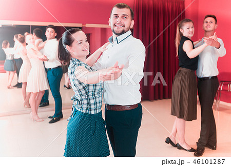 Cheerful dancing couples enjoying foxtrot 46101287