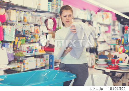 girl is choosing baby towel 46101592