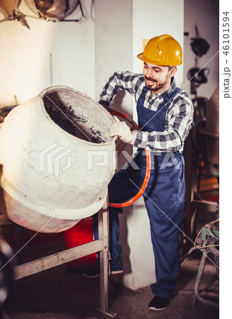 working man practicing his skills with mixing unit at workshop working man practicing his skills with mixing unit at workshop 46101594