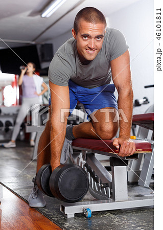 Guy doing exercises with dumbbells 46101811