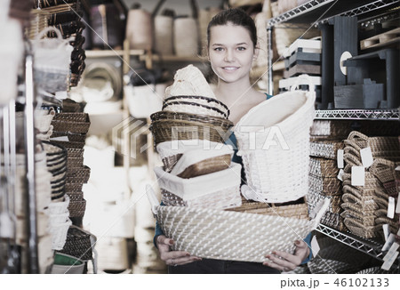 female demonstrates wicker baskets female demonstrates wicker baskets 46102133