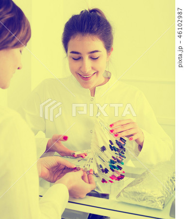 Woman doing manicure Woman doing manicure 46102987