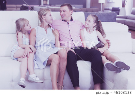 Family choosing sofa in store 46103133