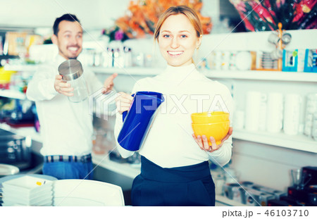 Couple selecting crockery in store Couple selecting crockery in store 46103710