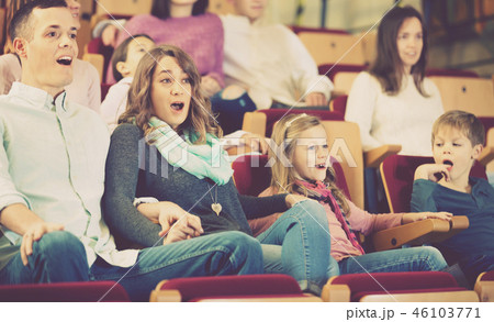 Number of people enjoying exciting film 46103771