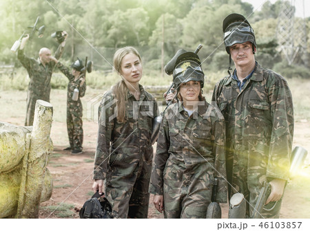 grieved young people, standing outdoors with protective mask wit grieved young people, standing outdoors with protective mask wit 46103857