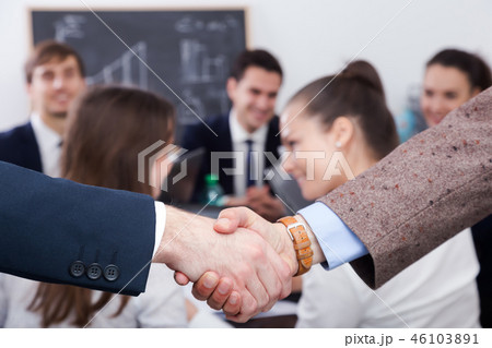Business handshake at office meeting. Business handshake at office meeting. 46103891