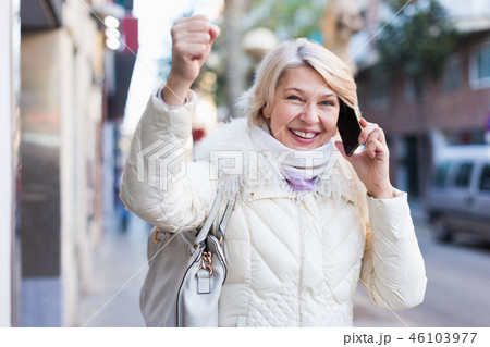 Happy female raise hand up and talking on phone Happy female raise hand up and talking on phone 46103977