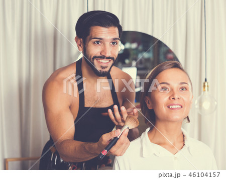 Professional makeup artist applying cosmetics 46104157