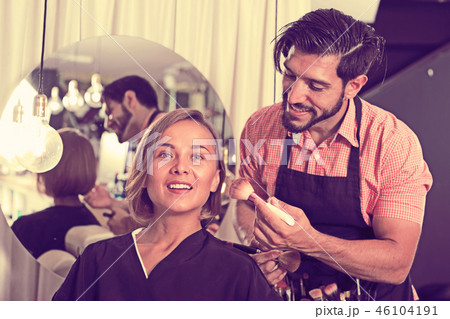 makeup artist applying cosmetics for female makeup artist applying cosmetics for female 46104191