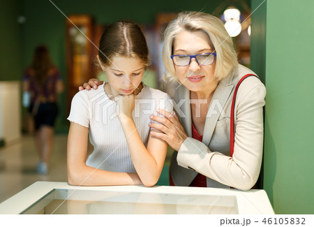 Woman and girl visiting museum Woman and girl visiting museum 46105832