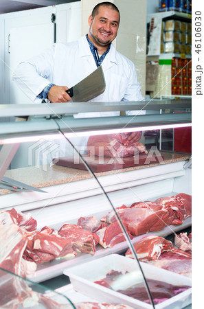 Male butcher in kosher section at supermarket 46106030