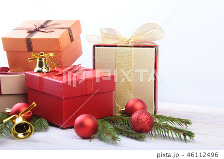 Happy Holidays. New Year or Christmas decorations with gift boxes, candles and balls. greeting card. 46112496
