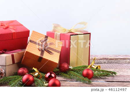 Happy Holidays. New Year or Christmas decorations with gift boxes, candles and balls. greeting card. 46112497