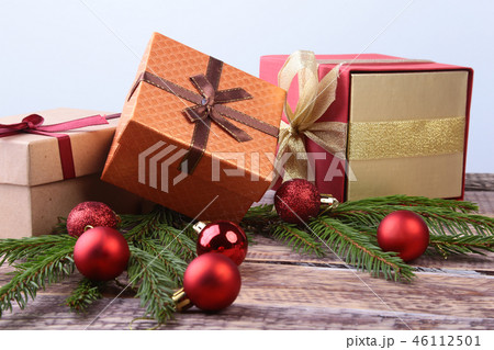Happy Holidays. New Year or Christmas decorations with gift boxes, candles and balls. greeting card. Happy Holidays. New Year or Christmas decorations with gift boxes, candles and balls. greeting card. 46112501