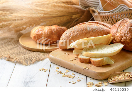 bread sliced and croissant on wood bread sliced and croissant on wood 46119059