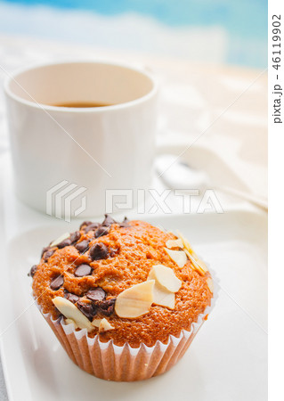 Break time with banana cake and coffee. 46119902