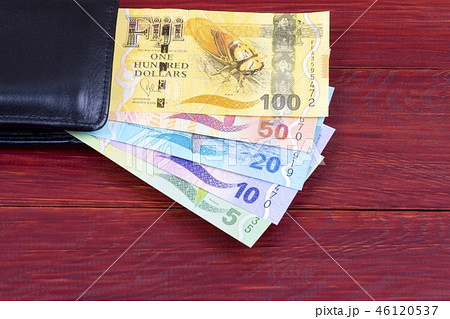 Fijian money in the black wallet  46120537