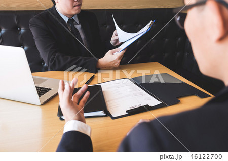 Employer arriving for a job interview, businessman listen to can Employer arriving for a job interview, businessman listen to can 46122700