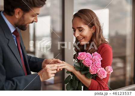 Happy male making marriage proposal to lady Happy male making marriage proposal to lady 46123537