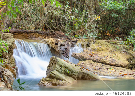 Waterfall flowing from the mountains . 46124582