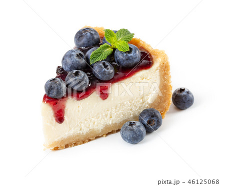 Piece of cheesecake with blueberries and mint 46125068
