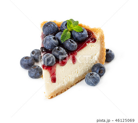 Piece of cheesecake with blueberries and mint 46125069
