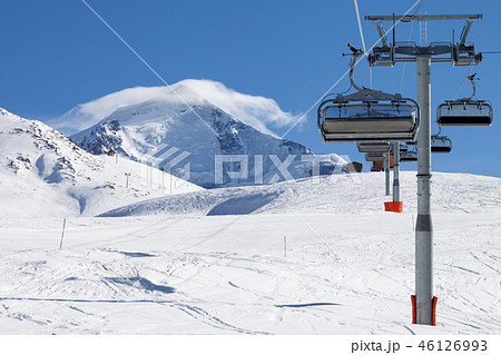 Ski-lift and ski slope in snowy mountain at winter Ski-lift and ski slope in snowy mountain at winter 46126993