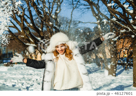 Cute winter woman in fur coat outdoor Cute winter woman in fur coat outdoor 46127601